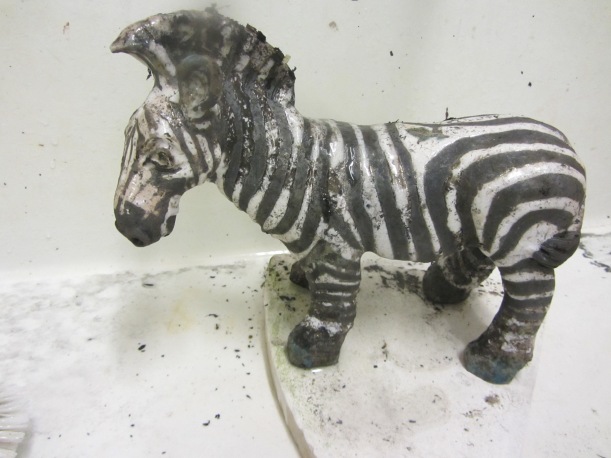 student work raku zebra black stripes made using masking tape resist before glazing